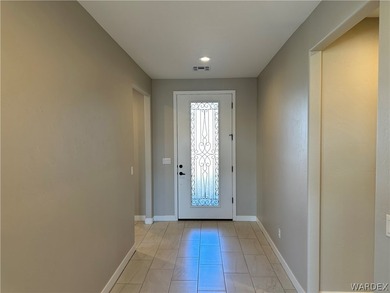 Welcome to your dream home in the prestigious Laughlin Ranch on Laughlin Ranch Golf Club in Arizona - for sale on GolfHomes.com, golf home, golf lot