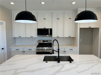 Welcome to your dream home in the prestigious Laughlin Ranch on Laughlin Ranch Golf Club in Arizona - for sale on GolfHomes.com, golf home, golf lot