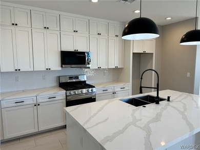 Welcome to your dream home in the prestigious Laughlin Ranch on Laughlin Ranch Golf Club in Arizona - for sale on GolfHomes.com, golf home, golf lot