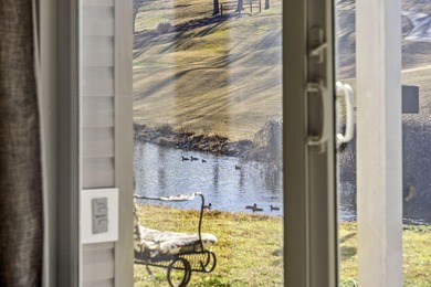 Wake up to the gentle shimmer of Lake Taneycomo right outside on Pointe Royale Village Country Club in Missouri - for sale on GolfHomes.com, golf home, golf lot