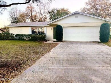 Nestled on a tree-lined dead-end street, this charming CBS-built on Crane Creek Reserve Golf Club in Florida - for sale on GolfHomes.com, golf home, golf lot