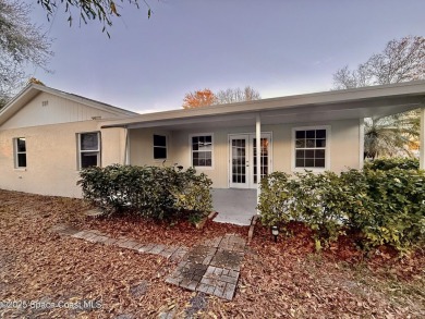 Nestled on a tree-lined dead-end street, this charming CBS-built on Crane Creek Reserve Golf Club in Florida - for sale on GolfHomes.com, golf home, golf lot