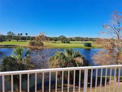 Welcome to this serene Country Club condo located at East Bay on East Bay Golf Club in Florida - for sale on GolfHomes.com, golf home, golf lot