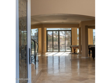 Nestled on the 4th fairway, this stunning 5,577 sq. ft. estate on London Bridge Golf Course in Arizona - for sale on GolfHomes.com, golf home, golf lot