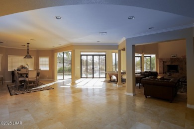Nestled on the 4th fairway, this stunning 5,577 sq. ft. estate on London Bridge Golf Course in Arizona - for sale on GolfHomes.com, golf home, golf lot