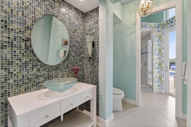 A prized location with sweeping panoramic golf and water views on BallenIsles Golf and Country Club in Florida - for sale on GolfHomes.com, golf home, golf lot