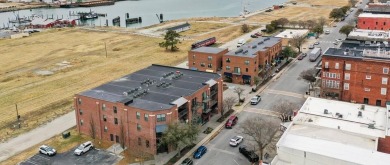 Contemporary condo with Cape Charles Harbor and Chesapeake Bay on Bay Creek Golf Club in Virginia - for sale on GolfHomes.com, golf home, golf lot