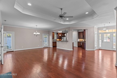Experience refined coastal living in this beautifully designed on Cape Fear National At Brunswick Forest in North Carolina - for sale on GolfHomes.com, golf home, golf lot