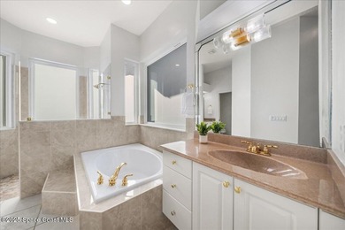 Step into this beautifully maintained pool home in the coveted on Viera East Golf Club in Florida - for sale on GolfHomes.com, golf home, golf lot