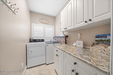 Step into this beautifully maintained pool home in the coveted on Viera East Golf Club in Florida - for sale on GolfHomes.com, golf home, golf lot