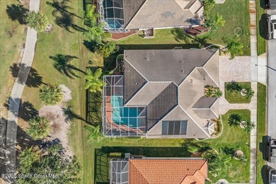 Step into this beautifully maintained pool home in the coveted on Viera East Golf Club in Florida - for sale on GolfHomes.com, golf home, golf lot