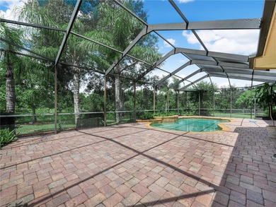 Elegant cul-de-sac home with pool, lake, and nature preserve on The Club at Eaglebrooke in Florida - for sale on GolfHomes.com, golf home, golf lot