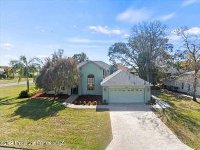 Situated on a large .34 corner lot, this beautifully landscaped on Glen Lakes Country Club in Florida - for sale on GolfHomes.com, golf home, golf lot