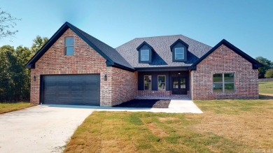 Located in an upscale cul-de-sac, this elegant home sits on a on Persimmon Ridge Golf Club in Arkansas - for sale on GolfHomes.com, golf home, golf lot