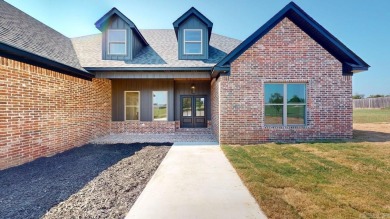 Located in an upscale cul-de-sac, this elegant home sits on a on Persimmon Ridge Golf Club in Arkansas - for sale on GolfHomes.com, golf home, golf lot