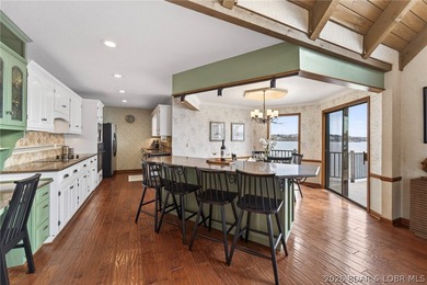 Timeless Tudor elegance meets effortless lake living in this on The Club At Porto Cima in Missouri - for sale on GolfHomes.com, golf home, golf lot