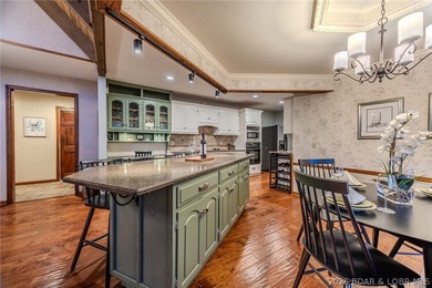 Timeless Tudor elegance meets effortless lake living in this on The Club At Porto Cima in Missouri - for sale on GolfHomes.com, golf home, golf lot