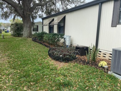 THIS SPECTACULAR 2/2 WITH A 12 X 24 SCREEN ROOM IS SELLING FOR on Lake Henry Golf Club in Florida - for sale on GolfHomes.com, golf home, golf lot