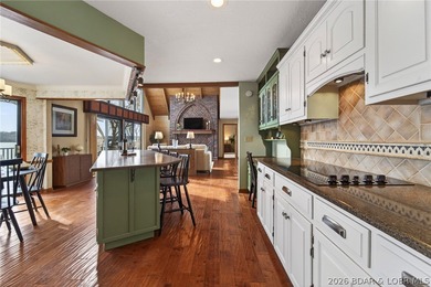 Timeless Tudor elegance meets effortless lake living in this on The Club At Porto Cima in Missouri - for sale on GolfHomes.com, golf home, golf lot