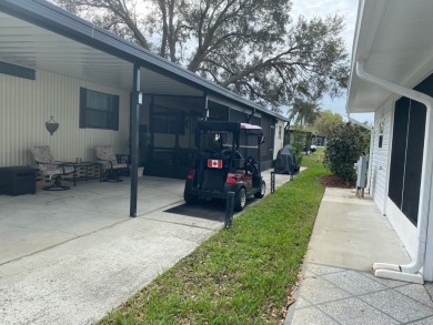 THIS SPECTACULAR 2/2 WITH A 12 X 24 SCREEN ROOM IS SELLING FOR on Lake Henry Golf Club in Florida - for sale on GolfHomes.com, golf home, golf lot