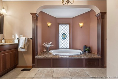 Timeless Tudor elegance meets effortless lake living in this on The Club At Porto Cima in Missouri - for sale on GolfHomes.com, golf home, golf lot