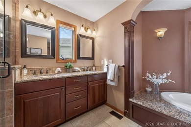 Timeless Tudor elegance meets effortless lake living in this on The Club At Porto Cima in Missouri - for sale on GolfHomes.com, golf home, golf lot