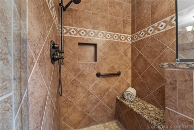 Timeless Tudor elegance meets effortless lake living in this on The Club At Porto Cima in Missouri - for sale on GolfHomes.com, golf home, golf lot