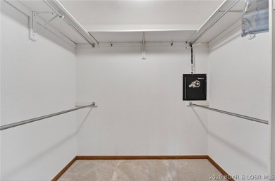 Timeless Tudor elegance meets effortless lake living in this on The Club At Porto Cima in Missouri - for sale on GolfHomes.com, golf home, golf lot