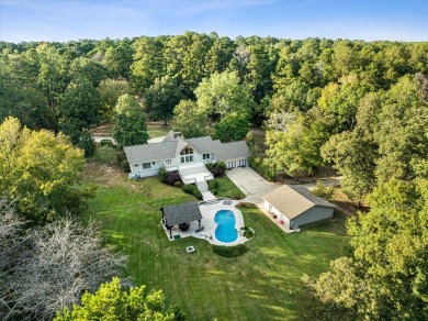 Welcome to a sophisticated retreat with a lodge-inspired charm on Quail Hallow Golf Course in Mississippi - for sale on GolfHomes.com, golf home, golf lot