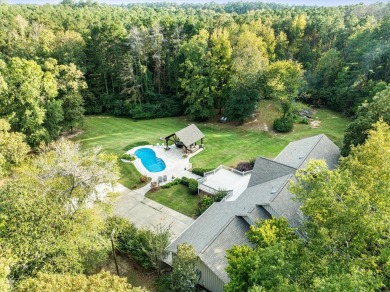 Welcome to a sophisticated retreat with a lodge-inspired charm on Quail Hallow Golf Course in Mississippi - for sale on GolfHomes.com, golf home, golf lot