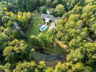 Welcome to a sophisticated retreat with a lodge-inspired charm on Quail Hallow Golf Course in Mississippi - for sale on GolfHomes.com, golf home, golf lot