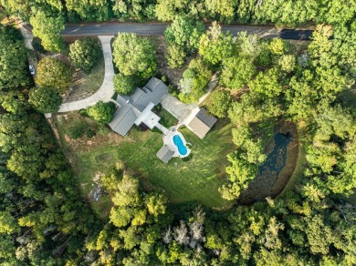 Welcome to a sophisticated retreat with a lodge-inspired charm on Quail Hallow Golf Course in Mississippi - for sale on GolfHomes.com, golf home, golf lot