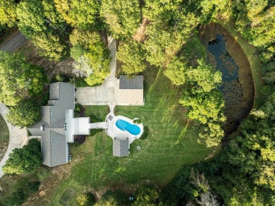 Welcome to a sophisticated retreat with a lodge-inspired charm on Quail Hallow Golf Course in Mississippi - for sale on GolfHomes.com, golf home, golf lot