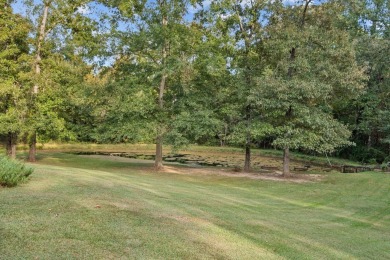 Welcome to a sophisticated retreat with a lodge-inspired charm on Quail Hallow Golf Course in Mississippi - for sale on GolfHomes.com, golf home, golf lot