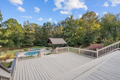 Welcome to a sophisticated retreat with a lodge-inspired charm on Quail Hallow Golf Course in Mississippi - for sale on GolfHomes.com, golf home, golf lot