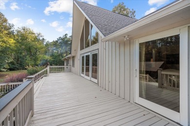 Welcome to a sophisticated retreat with a lodge-inspired charm on Quail Hallow Golf Course in Mississippi - for sale on GolfHomes.com, golf home, golf lot