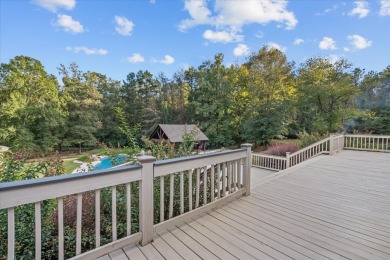 Welcome to a sophisticated retreat with a lodge-inspired charm on Quail Hallow Golf Course in Mississippi - for sale on GolfHomes.com, golf home, golf lot