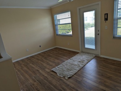 nice first floor unit.. vinyl flooring ...new range and on The American Golf Club in Florida - for sale on GolfHomes.com, golf home, golf lot