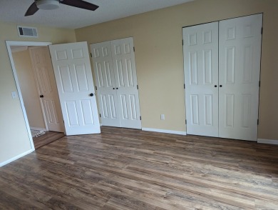 nice first floor unit.. vinyl flooring ...new range and on The American Golf Club in Florida - for sale on GolfHomes.com, golf home, golf lot