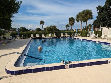 nice first floor unit.. vinyl flooring ...new range and on The American Golf Club in Florida - for sale on GolfHomes.com, golf home, golf lot