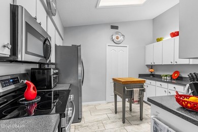 Welcome to this beautifully designed 3-bedroom, 2-bathroom home on Riviera Country Club in Florida - for sale on GolfHomes.com, golf home, golf lot