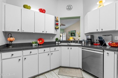 Welcome to this beautifully designed 3-bedroom, 2-bathroom home on Riviera Country Club in Florida - for sale on GolfHomes.com, golf home, golf lot