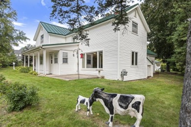 Welcome to this beautiful Colonial-style home located in the on Indian River Golf Club in Michigan - for sale on GolfHomes.com, golf home, golf lot