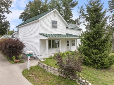 Welcome to this beautiful Colonial-style home located in the on Indian River Golf Club in Michigan - for sale on GolfHomes.com, golf home, golf lot