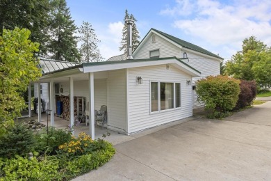 Welcome to this beautiful Colonial-style home located in the on Indian River Golf Club in Michigan - for sale on GolfHomes.com, golf home, golf lot