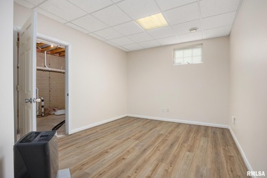 Welcome home to 4815 N. Weaverridge Boulevard! This 4-bedroom, 2 on WeaverRidge Golf Club in Illinois - for sale on GolfHomes.com, golf home, golf lot