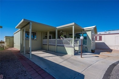 STUNNING EXTRA WIDE HOME ON AN OVERSIZED LOT WITH DESERT VIEWS on Riverview Golf Course in Arizona - for sale on GolfHomes.com, golf home, golf lot