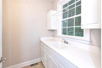 This classic brick Colonial offers enduring appeal paired with a on Fords Colony Country Club in Virginia - for sale on GolfHomes.com, golf home, golf lot