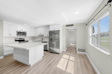 Experience resort-style living in this beautifully renovated on Kings Point Golf -Flanders Way in Florida - for sale on GolfHomes.com, golf home, golf lot