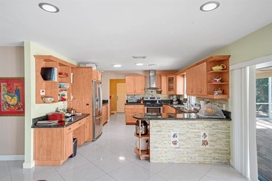 Beautifully maintained 3-bedroom, 3-bath home featuring an open on Woodlands Country Club in Florida - for sale on GolfHomes.com, golf home, golf lot